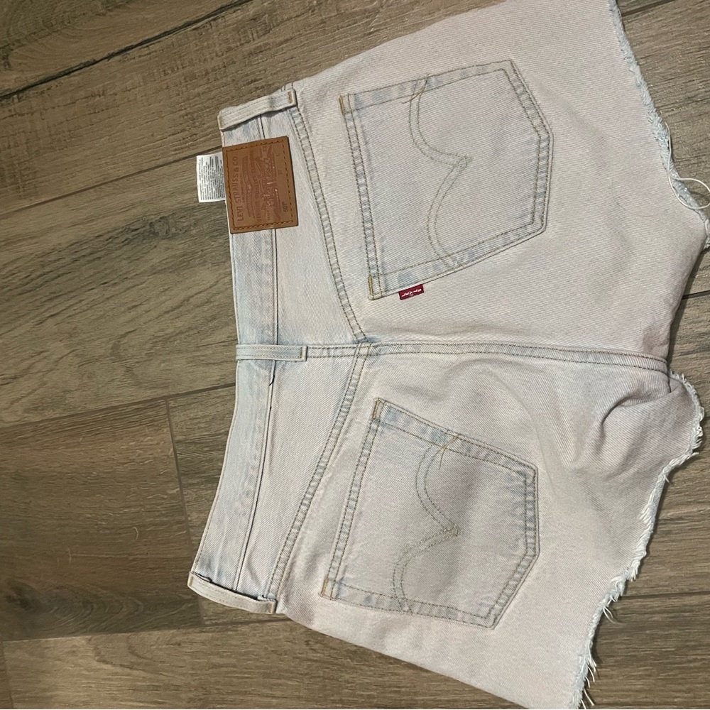 Levi’s |RARE 501 high-rise cut off shorts. Light wash with a pink wash. Size 27
